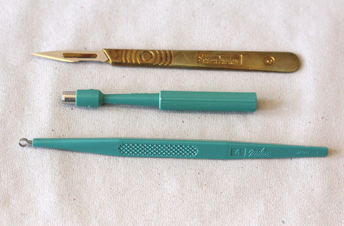 Figure 2  Equipment necessary: curette, circular knife (punch) and scalpel