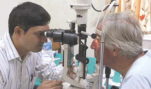 Suresh Pant examining Mons Lie with a slit lamp. (Photo Svein Lie)